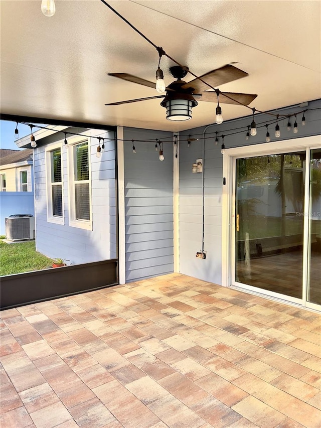 view of patio / terrace with ceiling fan and central AC unit