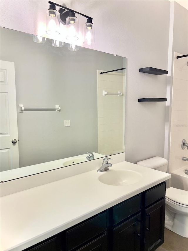 bathroom featuring shower / washtub combination, vanity, and toilet