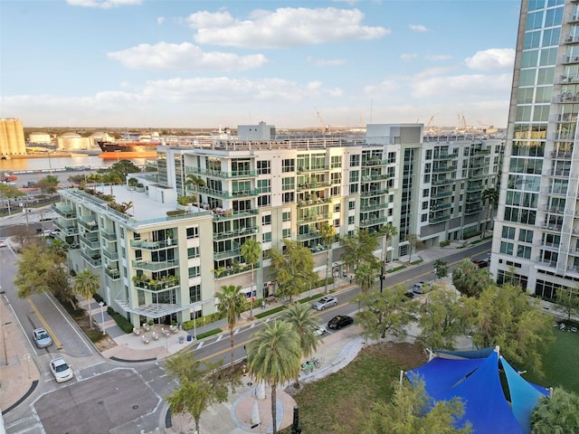 view of property featuring a water view and a view of city