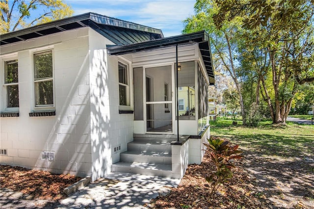 exterior space featuring concrete block siding and crawl space