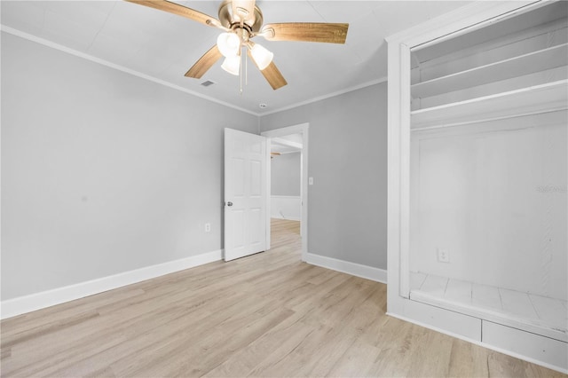 unfurnished bedroom with visible vents, baseboards, ornamental molding, a closet, and light wood-type flooring