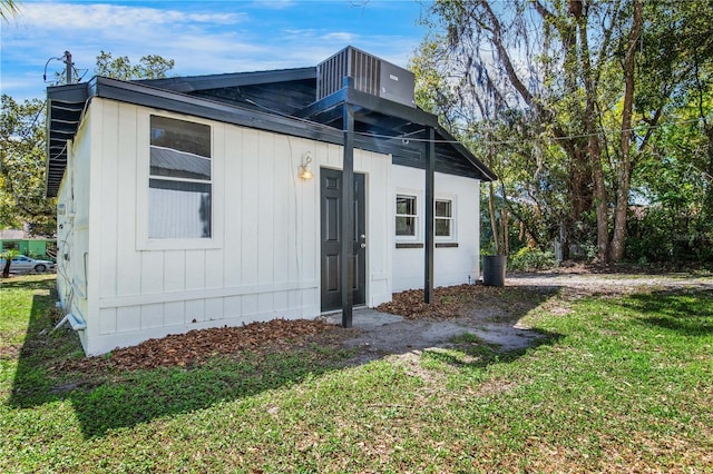 view of property exterior featuring a lawn