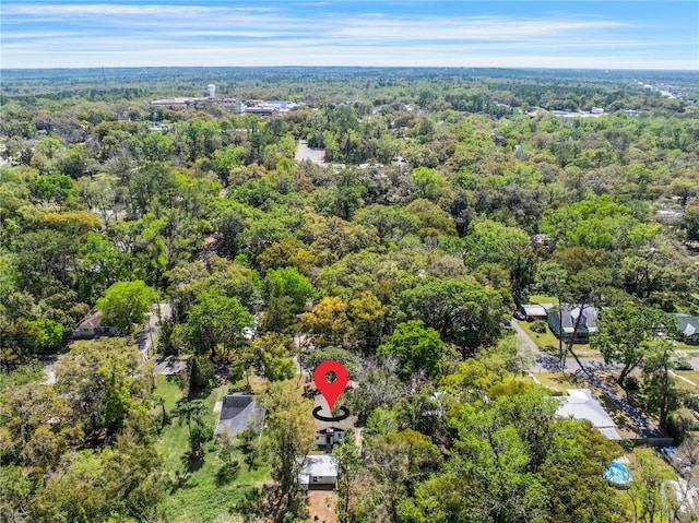 drone / aerial view featuring a forest view