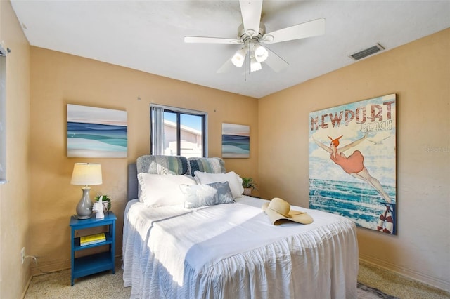 carpeted bedroom featuring visible vents, baseboards, and a ceiling fan