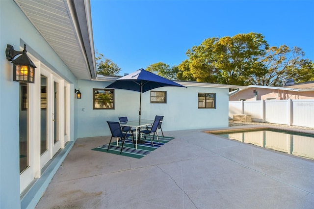 view of patio / terrace featuring outdoor dining area and fence