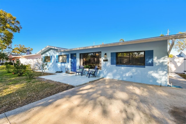 back of house featuring a patio area and fence