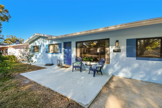 rear view of house with a patio area