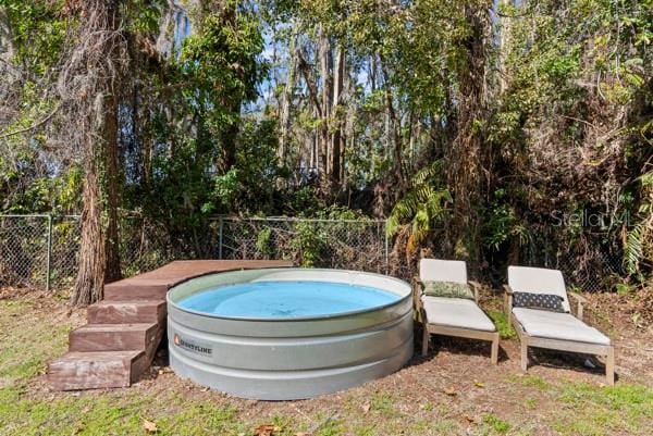 view of pool with fence