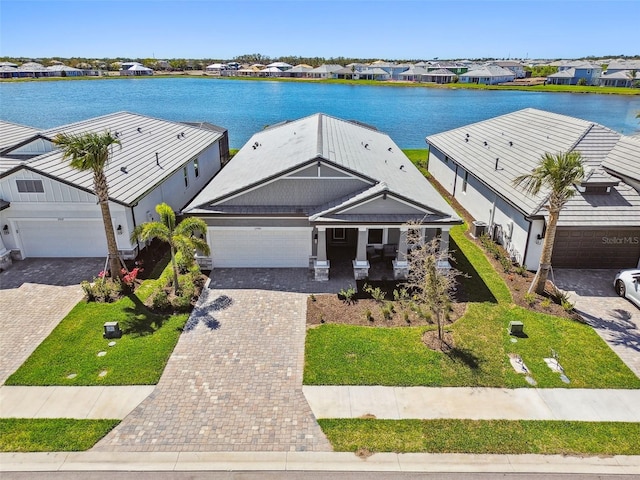 bird's eye view featuring a residential view and a water view