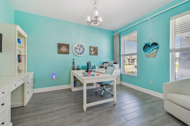 office area with a notable chandelier, baseboards, and wood finish floors