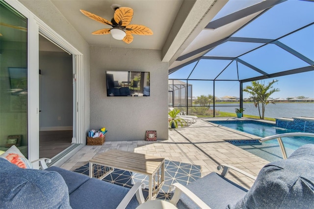 exterior space featuring glass enclosure, a patio, and a ceiling fan