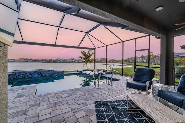 view of patio featuring an outdoor pool, a water view, a lanai, and ceiling fan