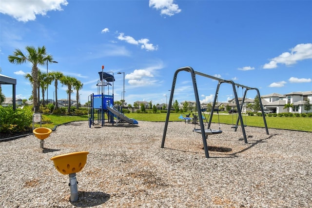 community jungle gym with a yard