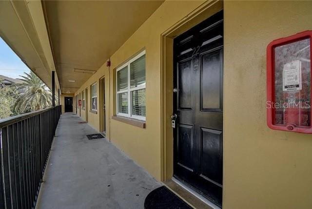 doorway to property with stucco siding