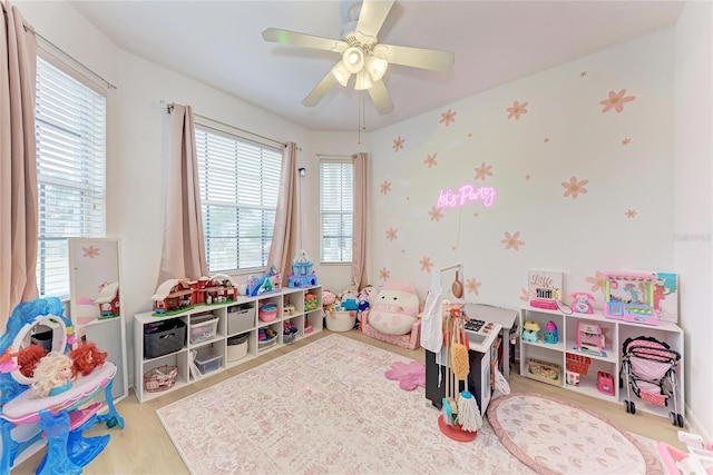 recreation room with a healthy amount of sunlight and a ceiling fan