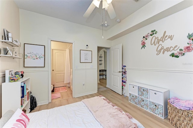 bedroom with light wood-style flooring and a ceiling fan