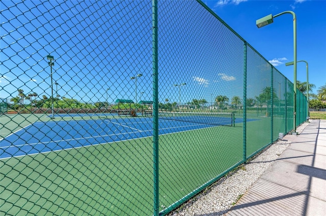 view of sport court with fence