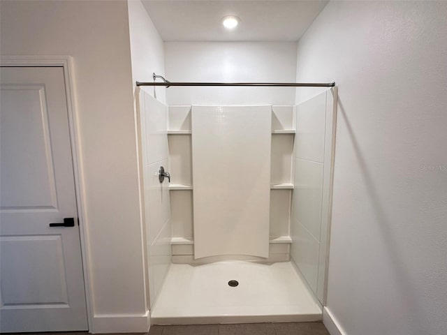 full bathroom featuring a stall shower