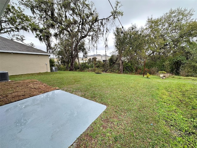 view of yard featuring central AC