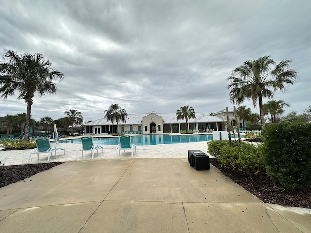 community pool with a patio area