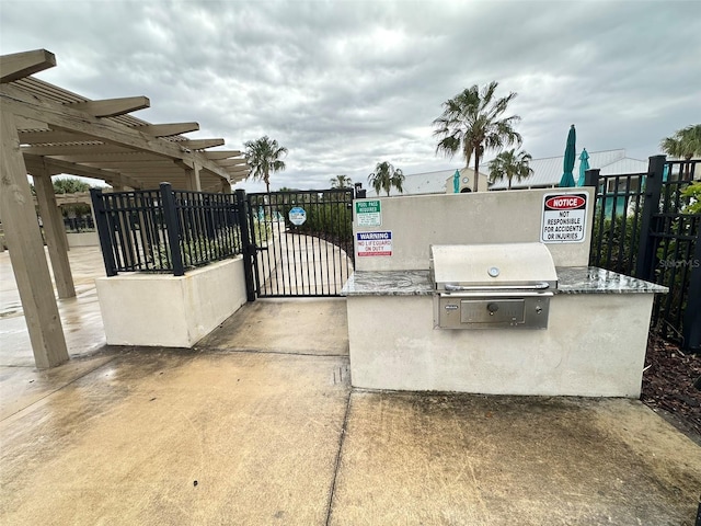 view of gate with fence and a pergola