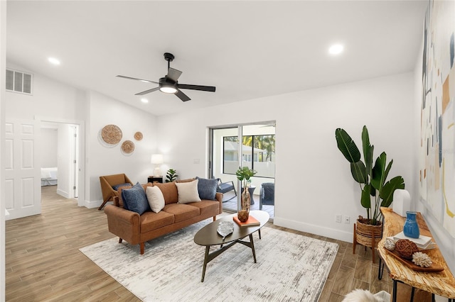 living room featuring light wood finished floors, recessed lighting, visible vents, ceiling fan, and baseboards