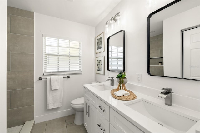 full bathroom with plenty of natural light, tile patterned flooring, a sink, and toilet