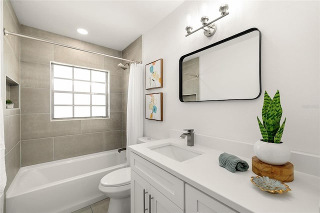 full bath with shower / tub combo, vanity, toilet, and tile patterned floors