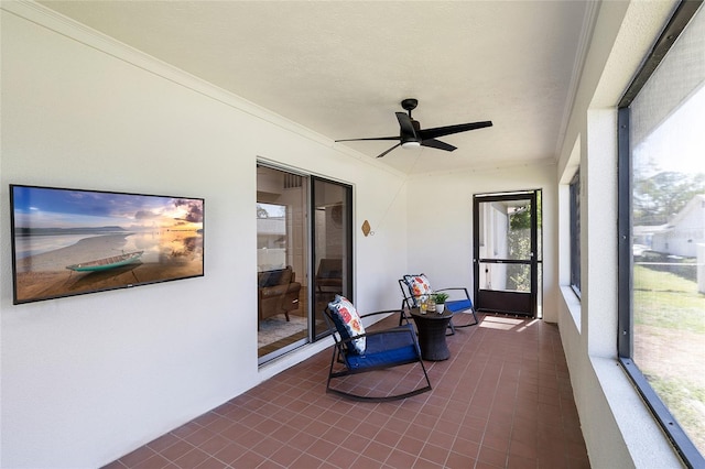 sunroom / solarium with ceiling fan