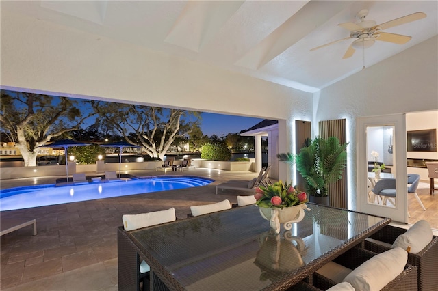 view of swimming pool featuring ceiling fan and a jacuzzi