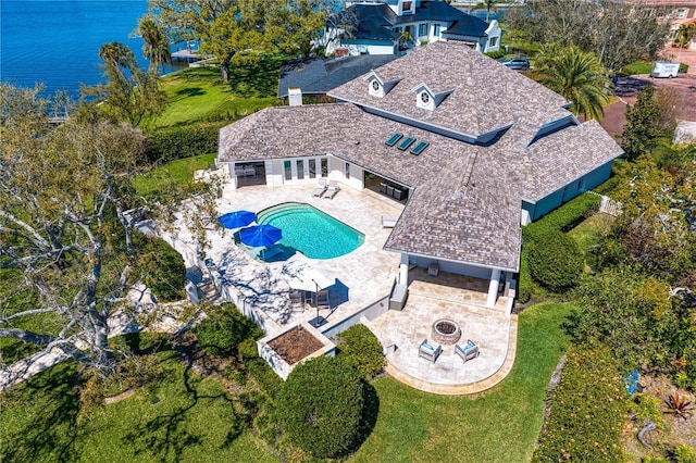 birds eye view of property featuring a water view