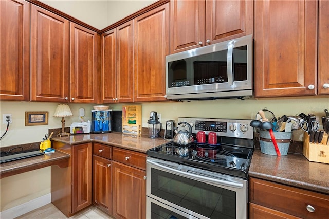 kitchen featuring brown cabinetry and stainless steel appliances