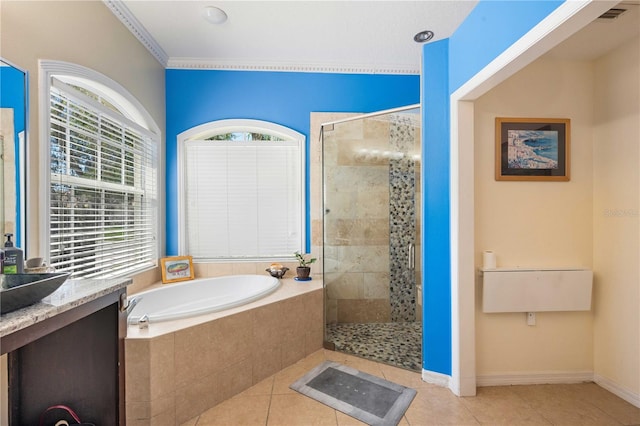 bathroom with baseboards, visible vents, tiled shower, tile patterned flooring, and a garden tub