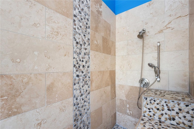 bathroom featuring a tile shower