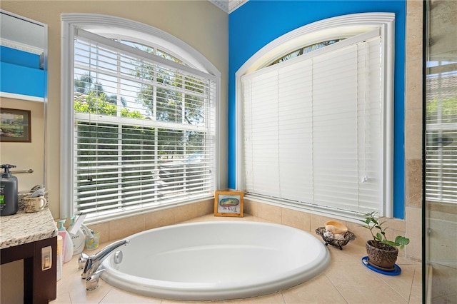 full bath with vanity and a garden tub