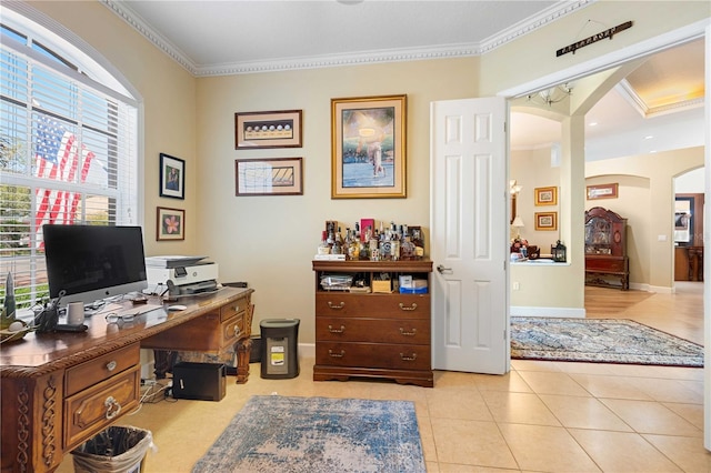 home office featuring crown molding, light tile patterned floors, baseboards, and arched walkways