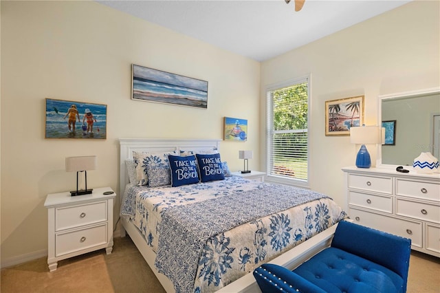 bedroom featuring baseboards and carpet