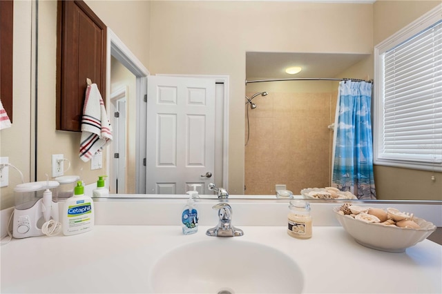 bathroom with vanity and a shower with shower curtain