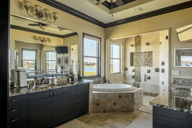 full bathroom featuring a garden tub, ornamental molding, a ceiling fan, a sink, and a shower stall