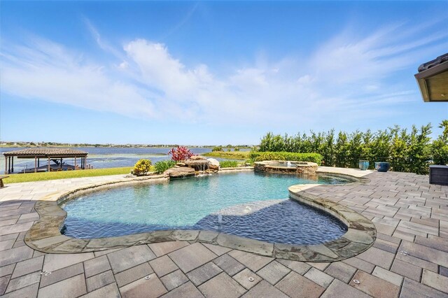 view of pool with a gazebo, a pool with connected hot tub, and a patio area