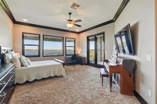 carpeted bedroom with a textured ceiling, french doors, access to outside, ornamental molding, and visible vents
