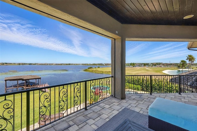 balcony featuring a water view