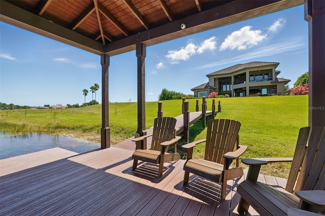 wooden terrace featuring a yard