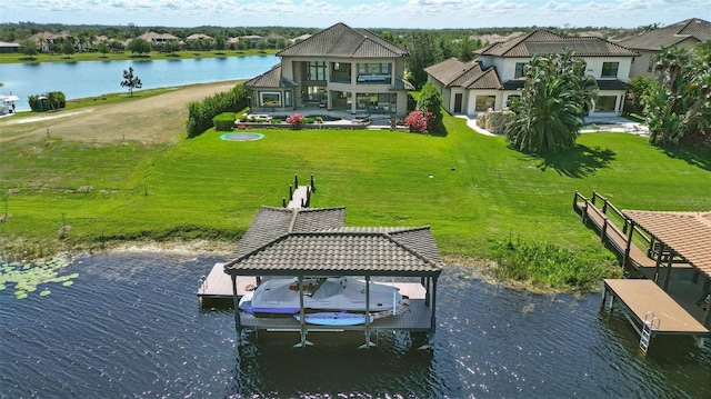 view of dock featuring a yard, a water view, and boat lift