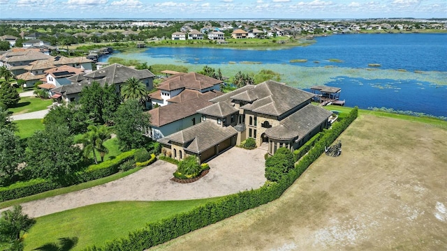 bird's eye view featuring a water view and a residential view