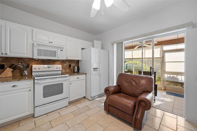 kitchen with white appliances, white cabinetry, ceiling fan, and backsplash