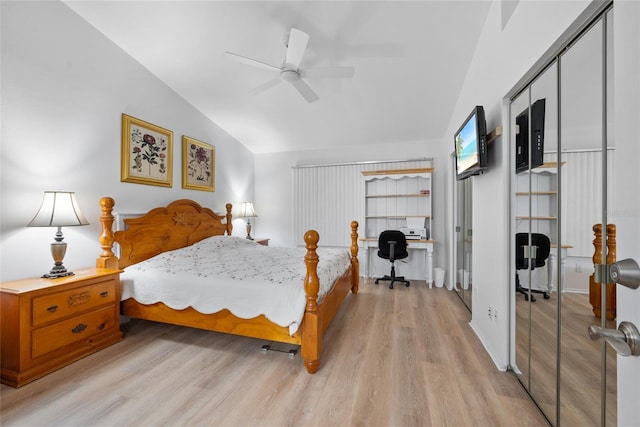 bedroom featuring vaulted ceiling, ceiling fan, and light wood-style floors