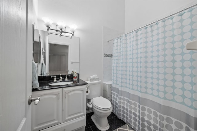 bathroom with toilet, vanity, a shower with shower curtain, and tile patterned floors