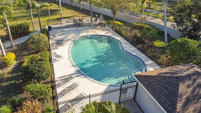 pool featuring a patio area and fence