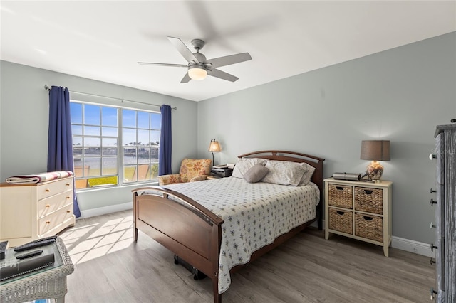 19029 US Highway 19 N Unit 7-9, Clearwater, FL 33764 - bedroom with a ceiling fan, baseboards, and wood finished floors